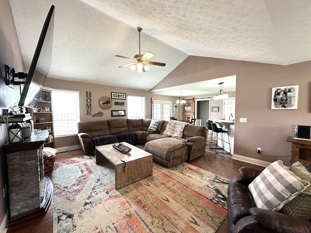 51 Stony Brook Dr, Corbin, KY 40701 - living area featuring wood finished floors, ceiling fan, a textured ceiling, vaulted ceiling, and a chandelier