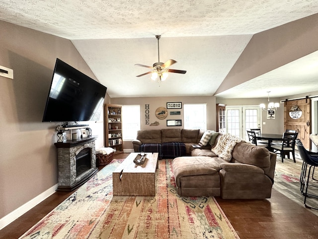51 Stony Brook Dr, Corbin, KY 40701 - living area featuring a ceiling fan, wood finished floors, a textured ceiling, lofted ceiling, and a fireplace