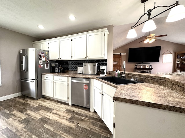 51 Stony Brook Dr, Corbin, KY 40701 - kitchen with stainless steel appliances, white cabinetry, dark wood-type flooring, backsplash, and a ceiling fan