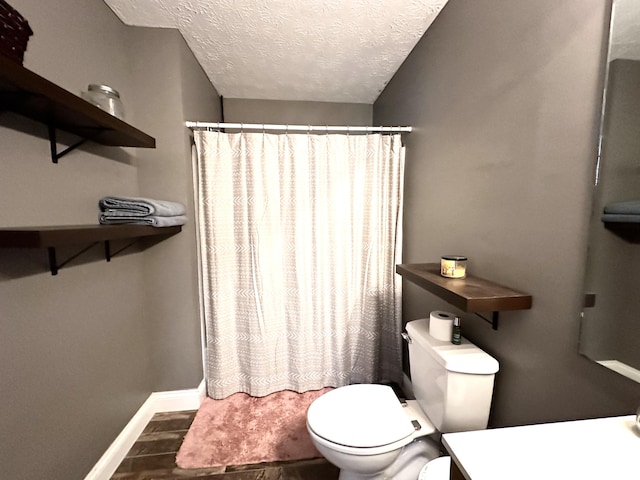 51 Stony Brook Dr, Corbin, KY 40701 - bathroom featuring a textured ceiling, vanity, curtained shower, and wood finished floors
