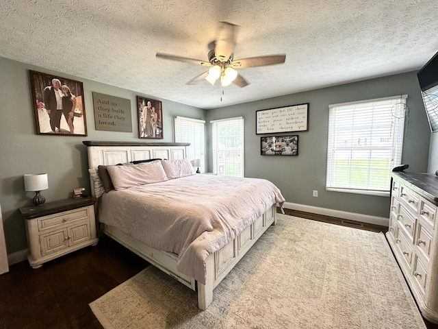 51 Stony Brook Dr, Corbin, KY 40701 - bedroom featuring dark wood finished floors, a textured ceiling, and a ceiling fan