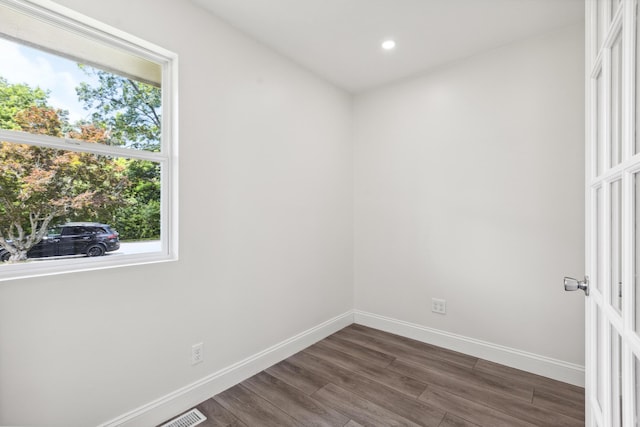117 S Cumberland St, Berea, KY 40403 - empty room with dark wood-style flooring, healthy amount of natural light, and recessed lighting