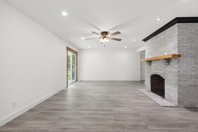 117 S Cumberland St, Berea, KY 40403 - unfurnished living room with a ceiling fan, a brick fireplace, recessed lighting, and light wood-type flooring