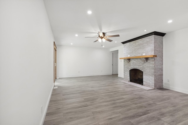 117 S Cumberland St, Berea, KY 40403 - unfurnished living room featuring recessed lighting, a ceiling fan, light wood-type flooring, and a brick fireplace