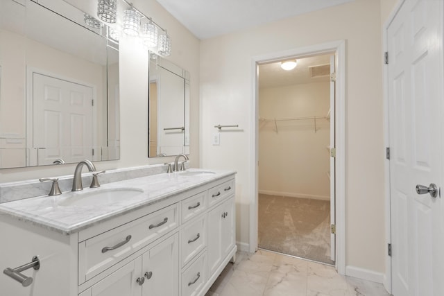 117 S Cumberland St, Berea, KY 40403 - bathroom featuring double vanity, marble look tiles, and a spacious closet