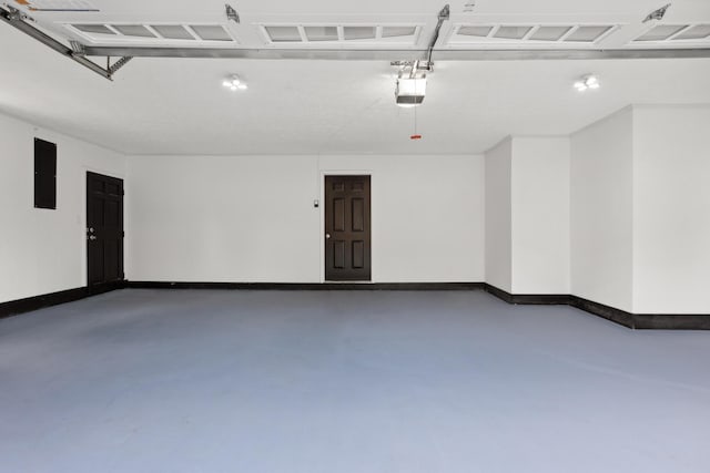 117 S Cumberland St, Berea, KY 40403 - garage featuring electric panel and a garage door opener