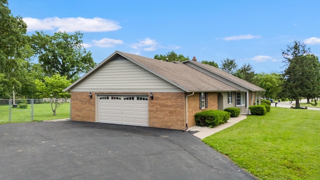 117 S Cumberland St, Berea, KY 40403 - ranch-style home with brick siding, driveway, a shingled roof, and an attached garage