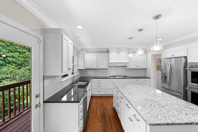 3605 Afton Pl, Lexington, KY 40515 - kitchen featuring stainless steel appliances, ornamental molding, a kitchen island, white cabinets, and tasteful backsplash