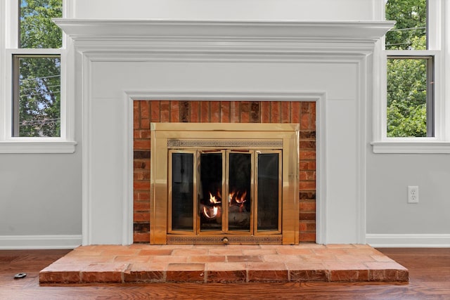 3605 Afton Pl, Lexington, KY 40515 - detailed view of a brick fireplace and wood finished floors