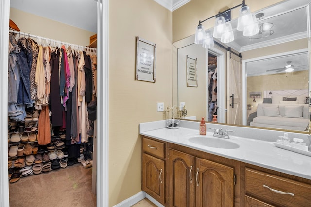 1211 Forest Circle Dr, Corbin, KY 40701 - bathroom featuring vanity, ornamental molding, a spacious closet, and ceiling fan