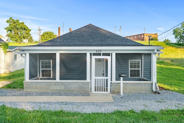 423 Perryville St, Harrodsburg, KY 40330 - rear view of house featuring a shingled roof and a sunroom