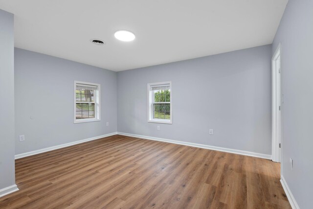423 Perryville St, Harrodsburg, KY 40330 - spare room featuring wood finished floors and baseboards