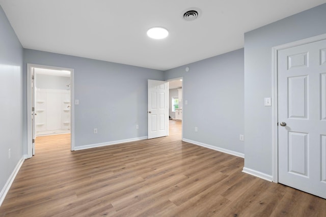 423 Perryville St, Harrodsburg, KY 40330 - unfurnished bedroom with wood finished floors and ensuite bathroom