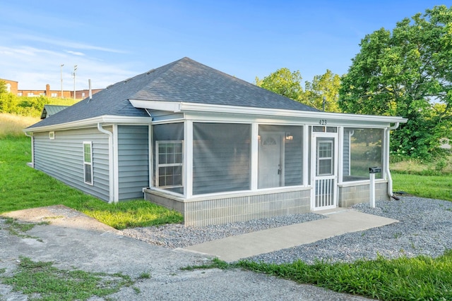 423 Perryville St, Harrodsburg, KY 40330 - rear view of property with a shingled roof and a sunroom