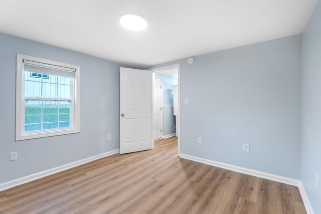 423 Perryville St, Harrodsburg, KY 40330 - unfurnished bedroom featuring wood finished floors