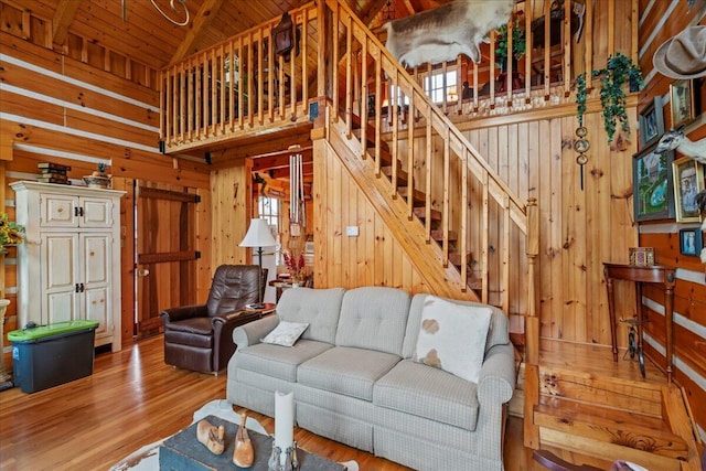 5045 Van Meter Rd, Winchester, KY 40391 - living area featuring wood walls, wood finished floors, stairway, wood ceiling, and high vaulted ceiling