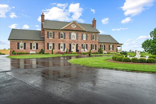 5045 Van Meter Rd, Winchester, KY 40391 - colonial home with a chimney, a front yard, and brick siding