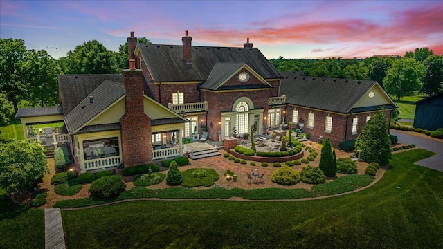 5045 Van Meter Rd, Winchester, KY 40391 - colonial house featuring french doors, a chimney, brick siding, a yard, and a porch