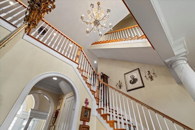 5045 Van Meter Rd, Winchester, KY 40391 - stairs with a high ceiling, arched walkways, ornamental molding, decorative columns, and a chandelier