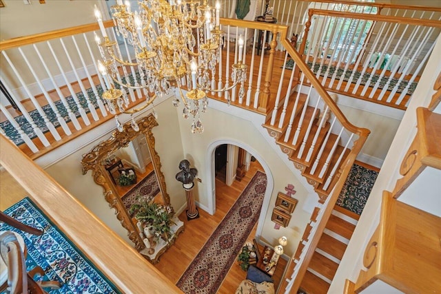 5045 Van Meter Rd, Winchester, KY 40391 - stairs with arched walkways, a chandelier, and wood finished floors