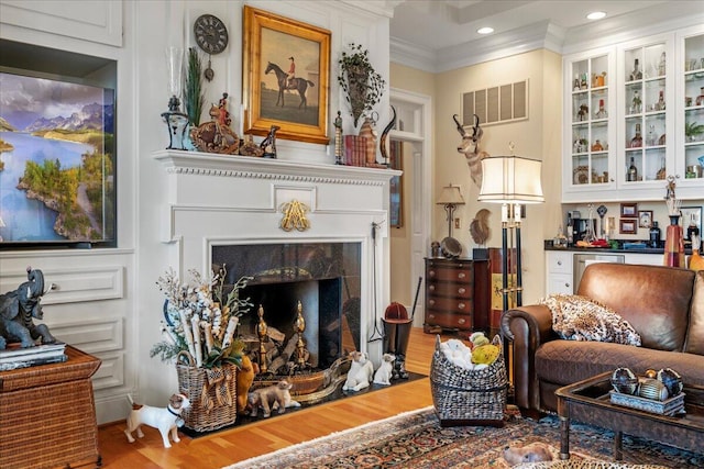 5045 Van Meter Rd, Winchester, KY 40391 - living area with wood finished floors, a fireplace, ornamental molding, and recessed lighting