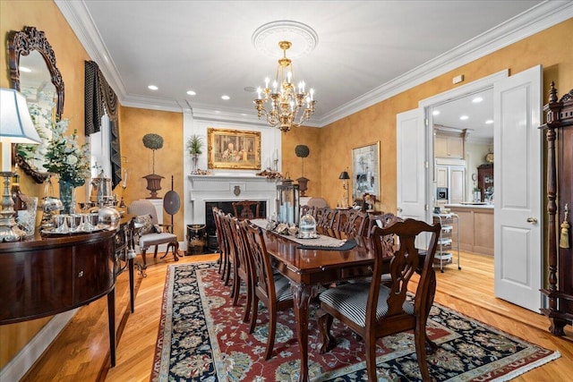 5045 Van Meter Rd, Winchester, KY 40391 - dining area featuring light wood-style floors, a chandelier, crown molding, and recessed lighting