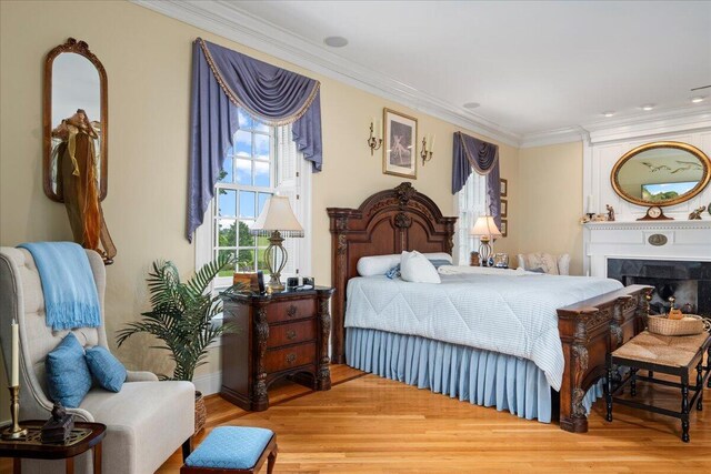 5045 Van Meter Rd, Winchester, KY 40391 - bedroom featuring crown molding, wood finished floors, and a fireplace