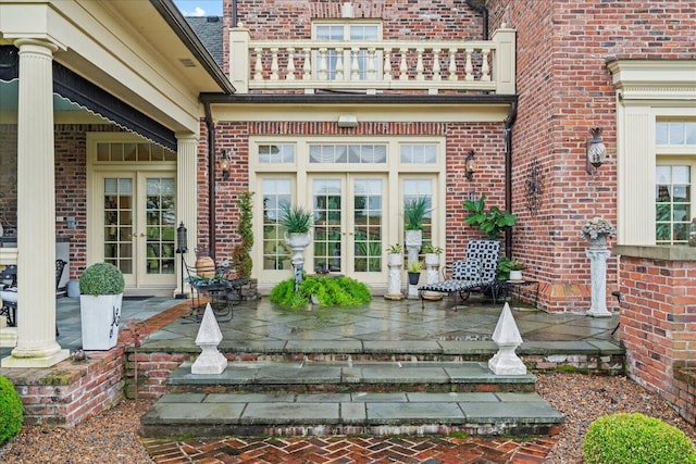 5045 Van Meter Rd, Winchester, KY 40391 - view of exterior entry with french doors, a balcony, and brick siding