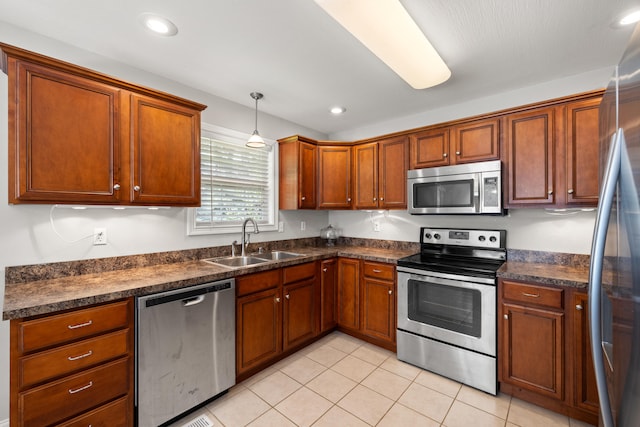 165 Rolling Meadows Dr, Stanford, KY 40484 - kitchen with stainless steel appliances, dark countertops, light tile patterned floors, brown cabinets, and recessed lighting