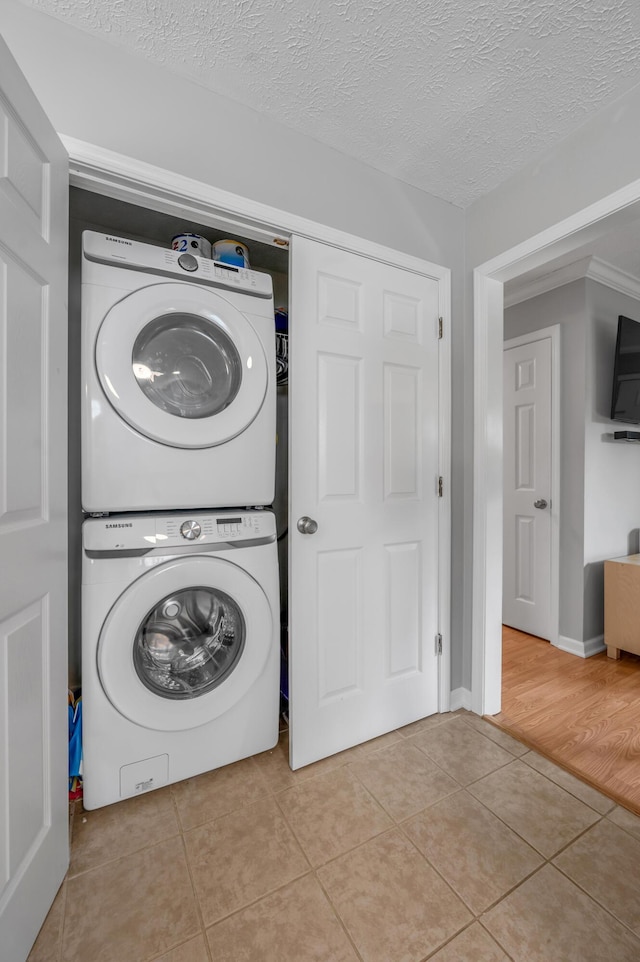 210 Taylorsville Trl, Georgetown, KY 40324 - laundry room with stacked washer / drying machine and tile patterned flooring
