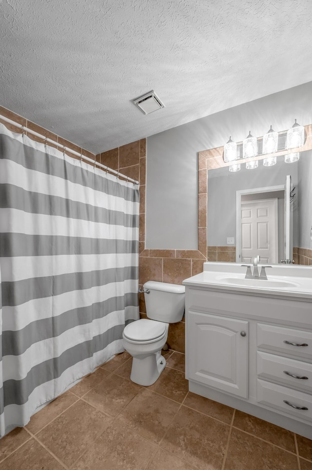 210 Taylorsville Trl, Georgetown, KY 40324 - bathroom with tile walls, vanity, a textured ceiling, tile patterned floors, and wainscoting