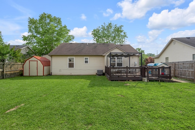 210 Taylorsville Trl, Georgetown, KY 40324 - back of property with a fenced backyard, a shed, a wooden deck, and a shingled roof