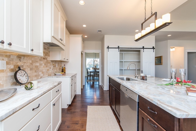 4185 Buttermilk Rd, Lexington, KY 40509 - kitchen featuring dishwasher, a barn door, white cabinetry, decorative backsplash, and recessed lighting