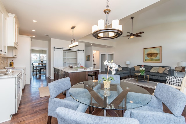 4185 Buttermilk Rd, Lexington, KY 40509 - dining area with a barn door, dark wood-style floors, ceiling fan, and recessed lighting