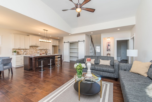 4185 Buttermilk Rd, Lexington, KY 40509 - living room featuring a barn door, lofted ceiling, a ceiling fan, dark wood-style floors, and recessed lighting