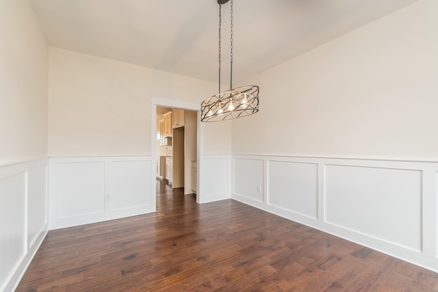 4185 Buttermilk Rd, Lexington, KY 40509 - unfurnished dining area with a decorative wall, wainscoting, and dark wood-style flooring