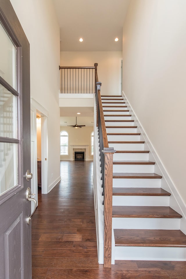 4185 Buttermilk Rd, Lexington, KY 40509 - staircase featuring a towering ceiling, wood finished floors, ceiling fan, and recessed lighting
