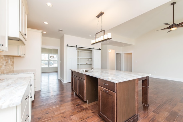 4185 Buttermilk Rd, Lexington, KY 40509 - kitchen with a barn door, a ceiling fan, recessed lighting, and dark wood-style floors
