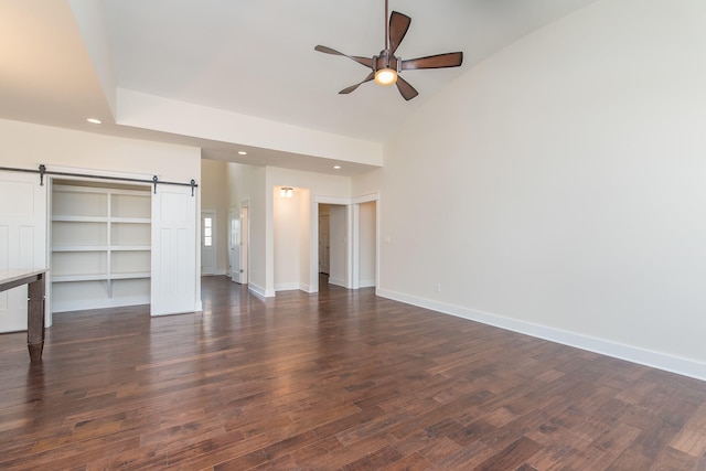4185 Buttermilk Rd, Lexington, KY 40509 - unfurnished bedroom with a barn door, recessed lighting, dark wood-type flooring, and a ceiling fan
