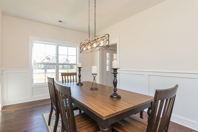 4185 Buttermilk Rd, Lexington, KY 40509 - dining area featuring a decorative wall, plenty of natural light, a wainscoted wall, dark wood-style floors, and a chandelier