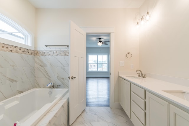 4185 Buttermilk Rd, Lexington, KY 40509 - full bathroom featuring a tub with marble appearance, marble finish floors, double vanity, and a ceiling fan
