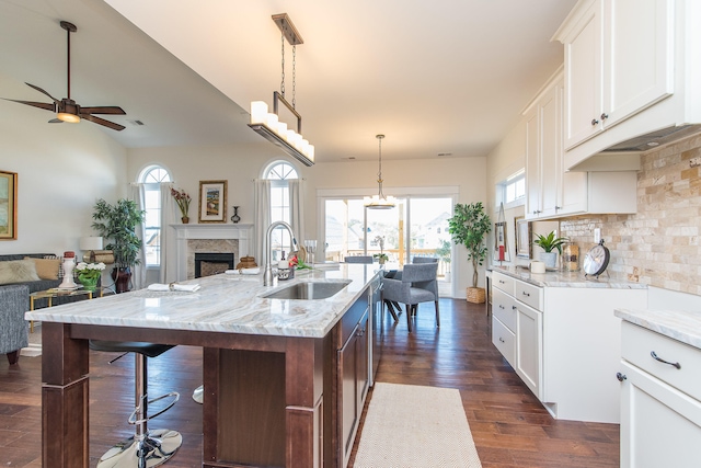 4185 Buttermilk Rd, Lexington, KY 40509 - kitchen with open floor plan, ceiling fan, light stone counters, backsplash, and dark wood finished floors