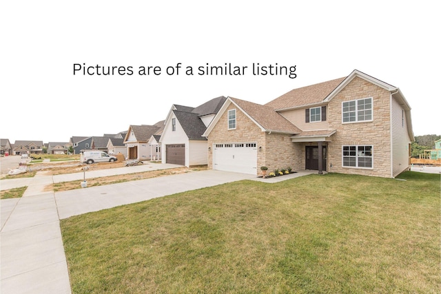 4185 Buttermilk Rd, Lexington, KY 40509 - view of front of house featuring stone siding, driveway, an attached garage, and a front yard