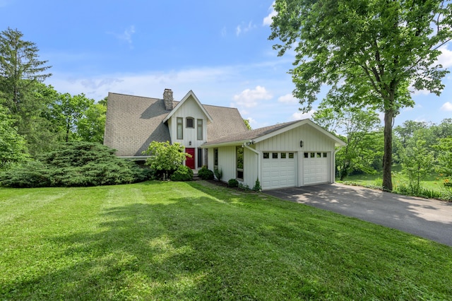 2968 Delong Rd, Lexington, KY 40515 - view of front of home with driveway, a garage, a chimney, and a front lawn