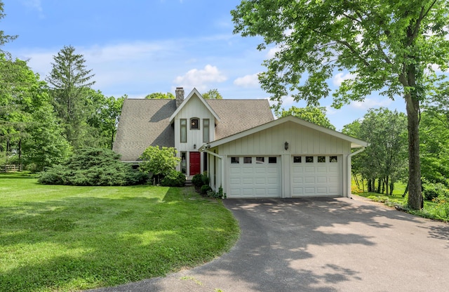 2968 Delong Rd, Lexington, KY 40515 - a-frame home with a chimney, asphalt driveway, roof with shingles, a garage, and a front yard