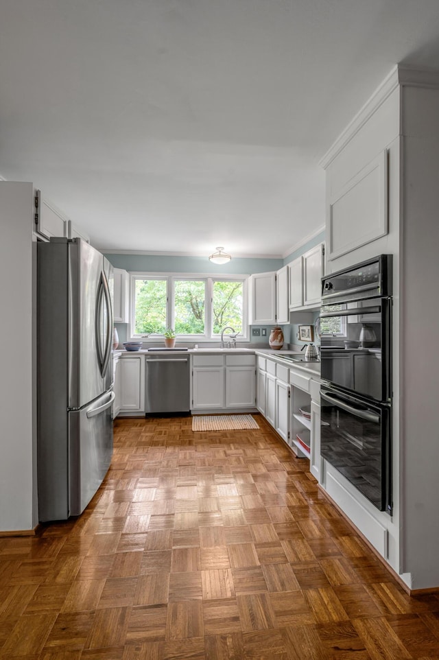 2968 Delong Rd, Lexington, KY 40515 - kitchen featuring appliances with stainless steel finishes, light countertops, and white cabinets