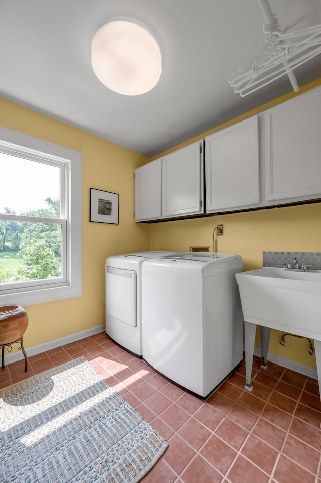 2968 Delong Rd, Lexington, KY 40515 - laundry room featuring washer and clothes dryer, cabinet space, and light tile patterned floors
