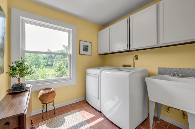 2968 Delong Rd, Lexington, KY 40515 - laundry room with cabinet space, separate washer and dryer, plenty of natural light, and light tile patterned flooring