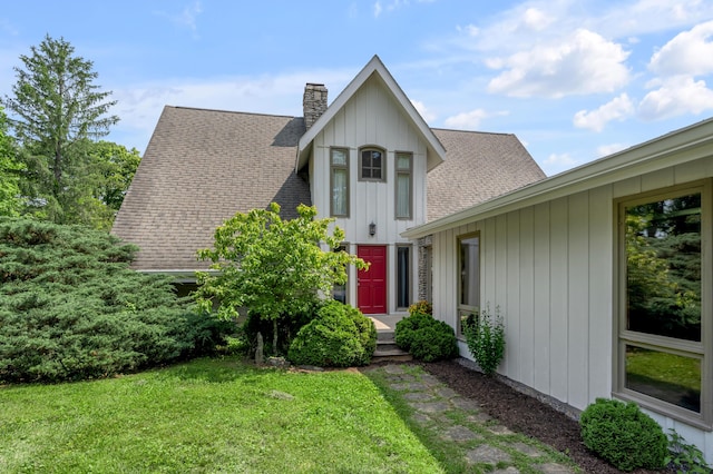2968 Delong Rd, Lexington, KY 40515 - view of front of house featuring roof with shingles, a front yard, and a chimney