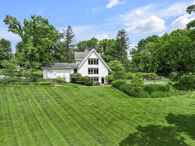 2968 Delong Rd, Lexington, KY 40515 - rear view of house featuring a yard and a chimney